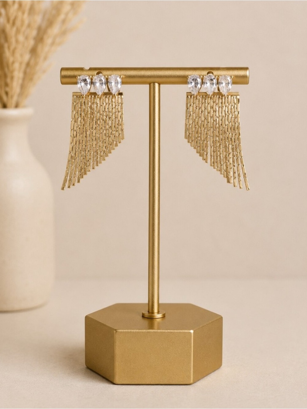 Gold Tone Teardrop Crystal Trio Ear
Jackets with Gold Fringe
